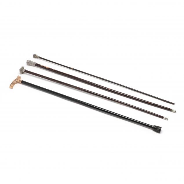 four-antique-walking-sticks-with-decorative-metal-handles