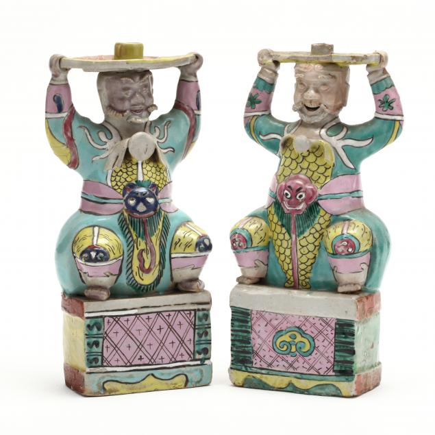 a-pair-of-chinese-figural-candle-holders