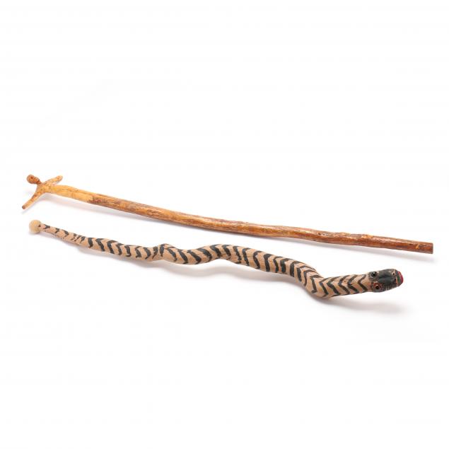 two-carved-folky-walking-sticks