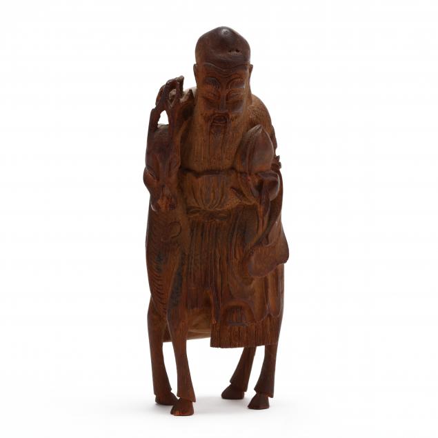 a-carved-wooden-figure-of-god-of-longevity