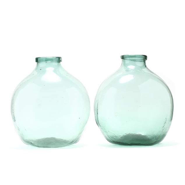 two-large-green-glass-demijohn-bottles