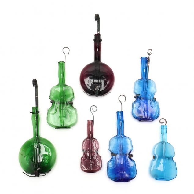 group-of-seven-musical-instrument-shaped-bottles