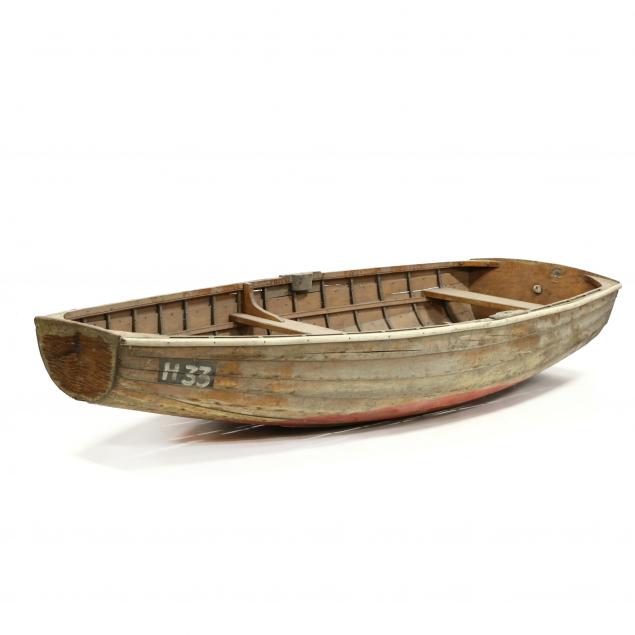 a-small-vintage-wood-dinghy-and-paddles-lucy