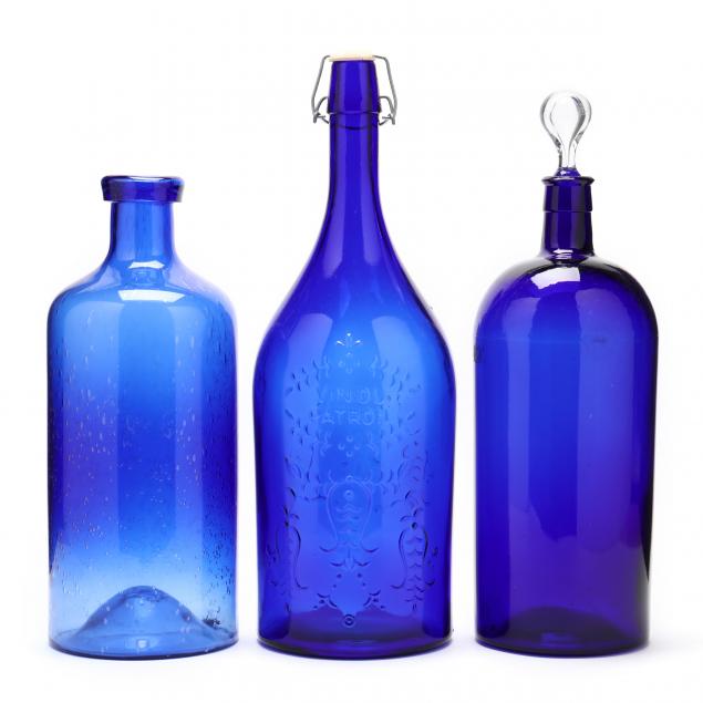three-large-cobalt-glass-bottles