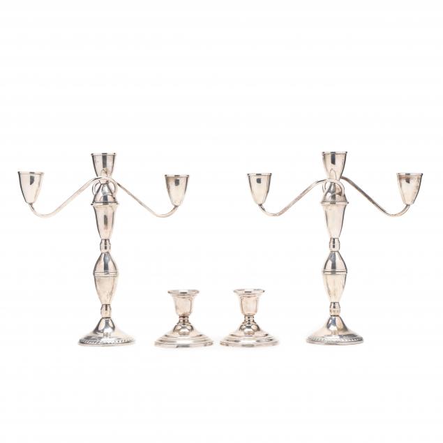 a-pair-of-sterling-silver-candelabra-and-a-pair-of-candlesticks