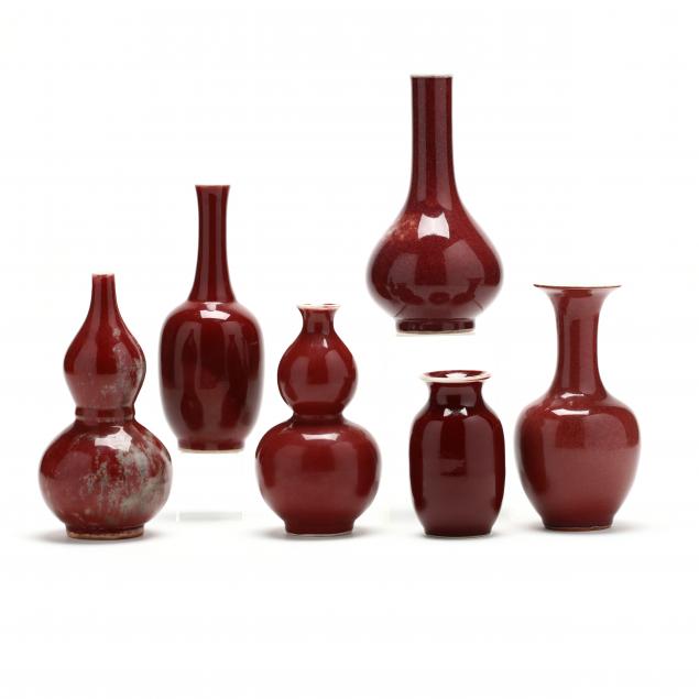 a-group-of-six-chinese-sang-de-boeuf-cabinet-vases