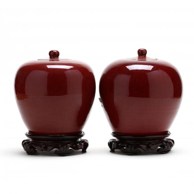 a-pair-of-chinese-sang-de-boeuf-lidded-jars