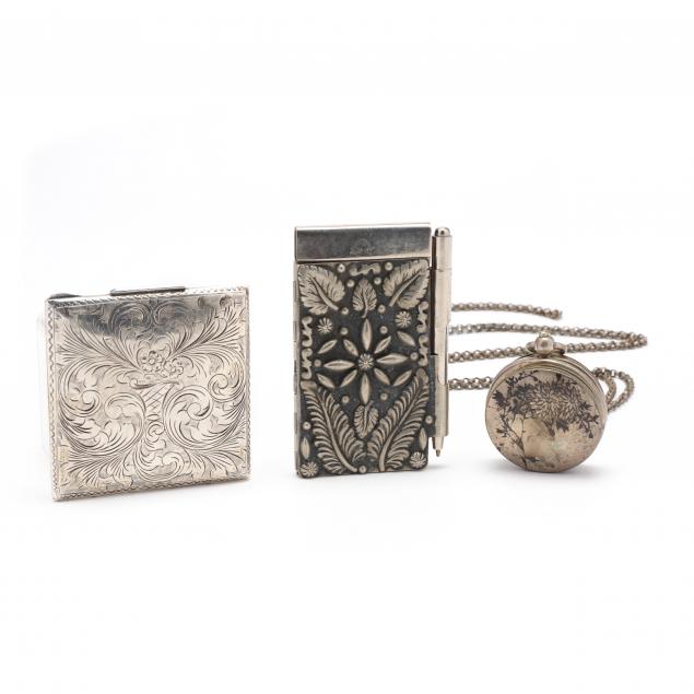 a-grouping-of-silver-and-silverplate-accessories