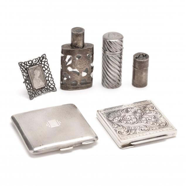 a-grouping-of-six-silver-vanity-accessories