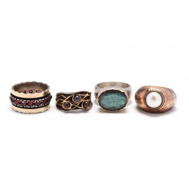 four-gold-and-silver-gem-set-rings
