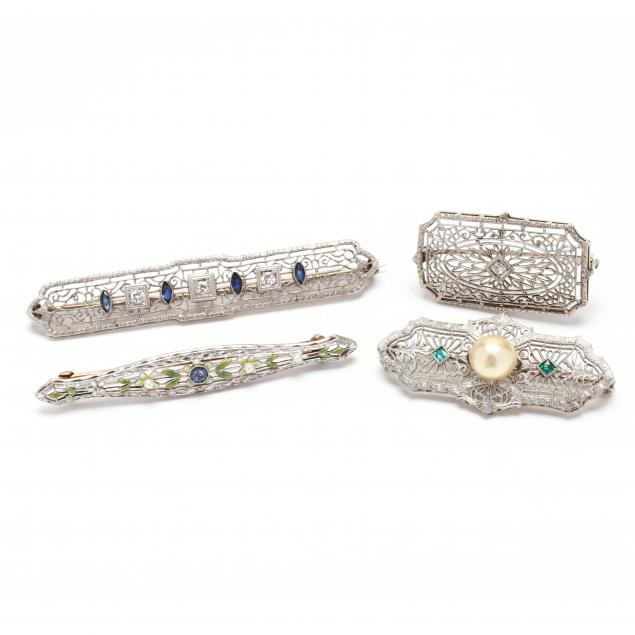 four-white-gold-and-gem-set-filigree-brooches