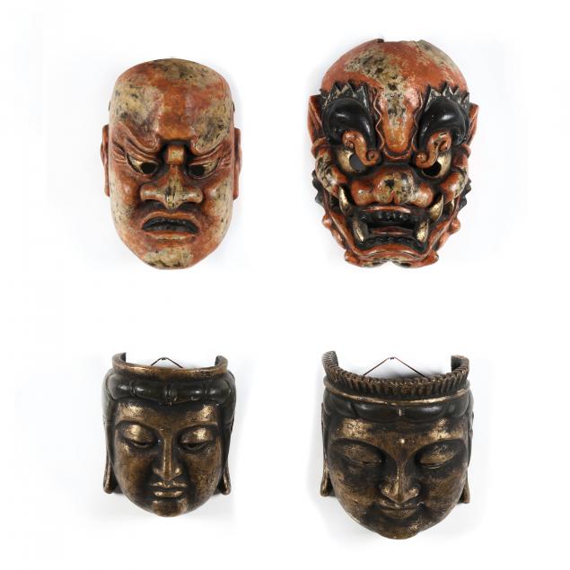 a-group-of-four-japanese-masks