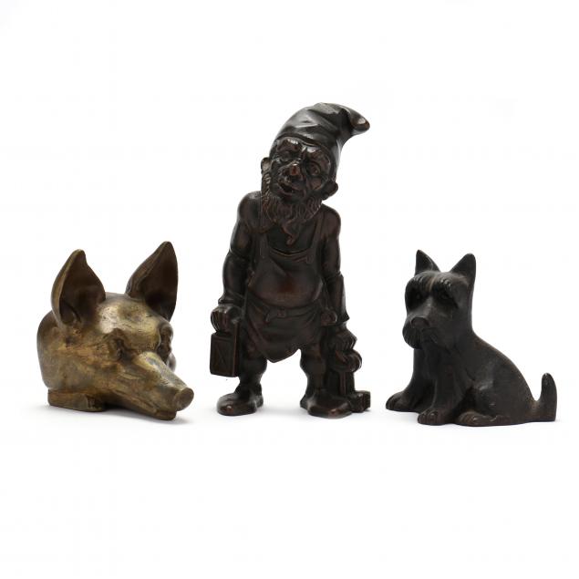 a-grouping-of-three-vintage-figural-door-stops