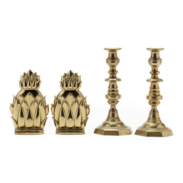 a-pair-of-brass-pineapple-bookends-and-candlesticks