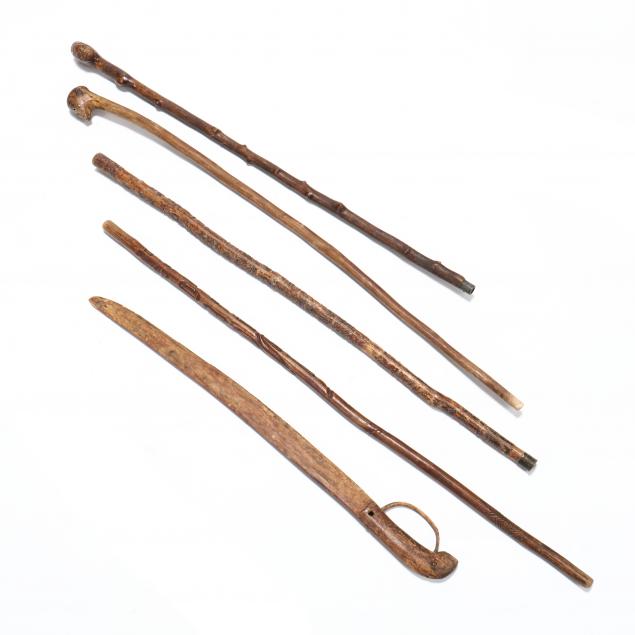 four-vintage-folk-art-canes-and-a-carved-toy-sword