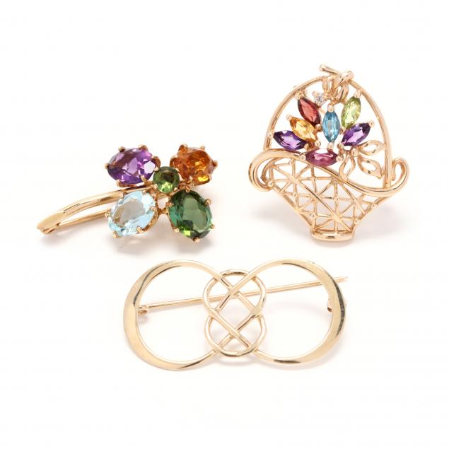 three-gold-and-gem-set-brooches