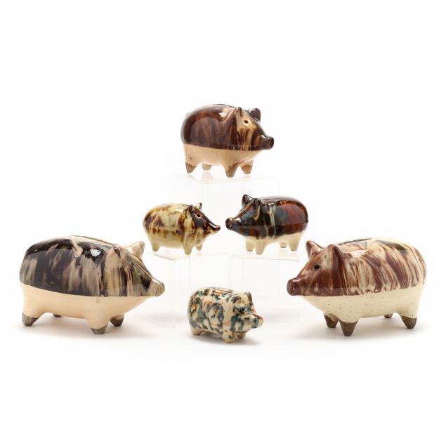 a-group-of-six-rockingham-style-pottery-pig-banks