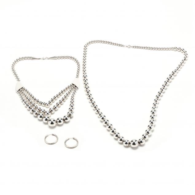 three-silver-jewelry-items