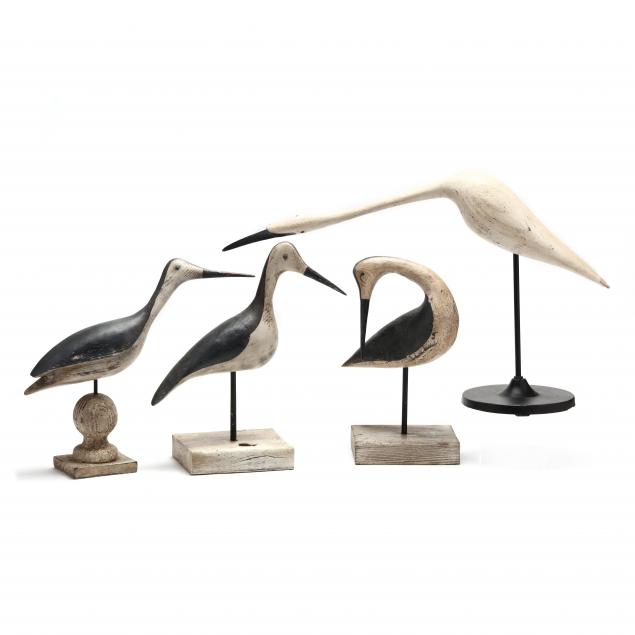 a-group-of-four-carved-wood-shorebirds