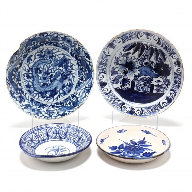 four-antique-dutch-delft-bowls-and-chargers