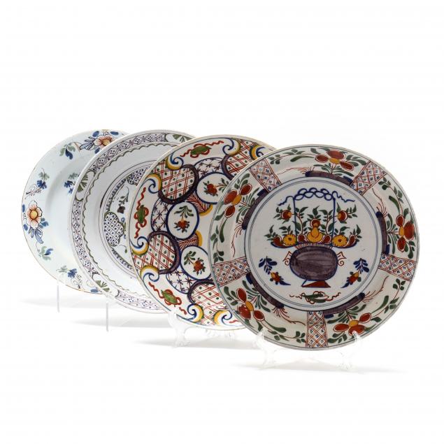 a-group-of-four-polychrome-delft-pancake-plates