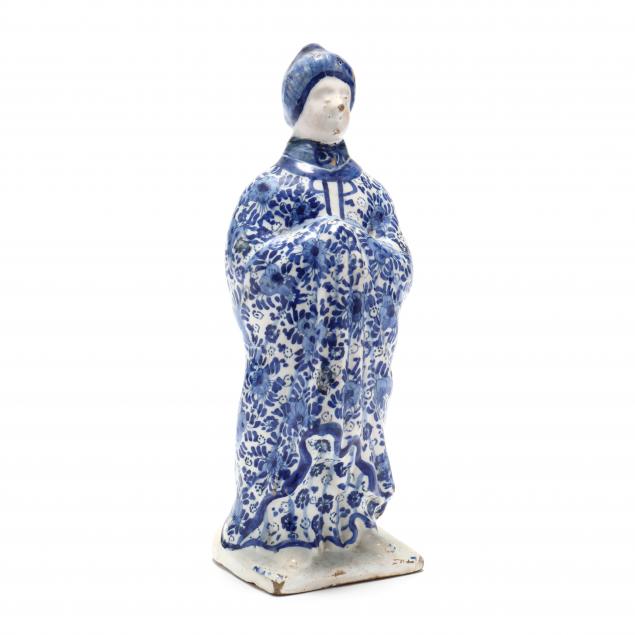a-blue-and-white-delft-figure-of-a-lady
