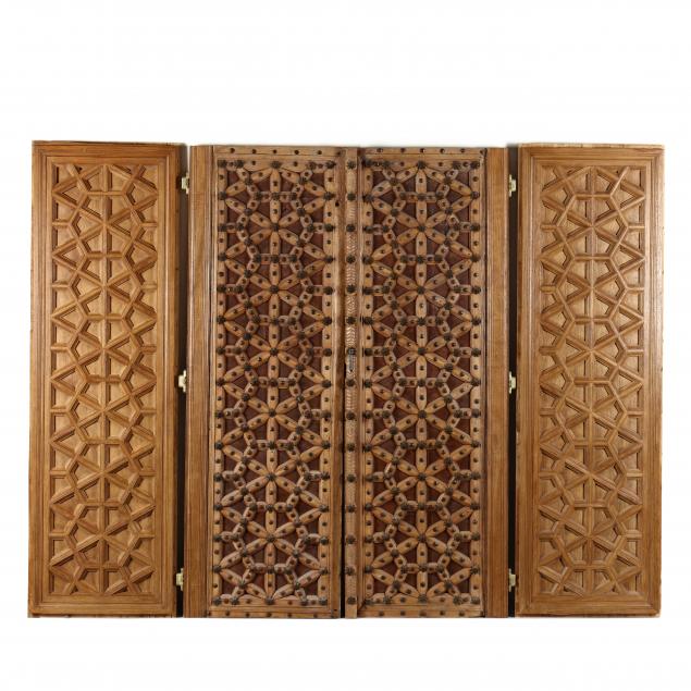 a-pair-of-mediterranean-geometric-wood-doors-and-panels