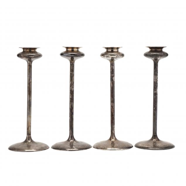 a-set-of-four-art-nouveau-sterling-silver-candlesticks