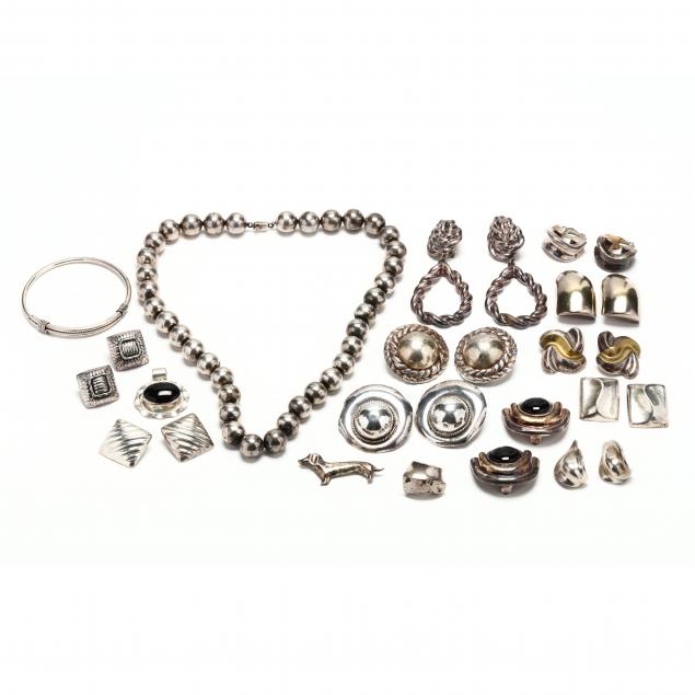 a-group-of-vintage-silver-jewelry