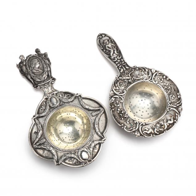 two-continental-silver-figural-tea-strainers