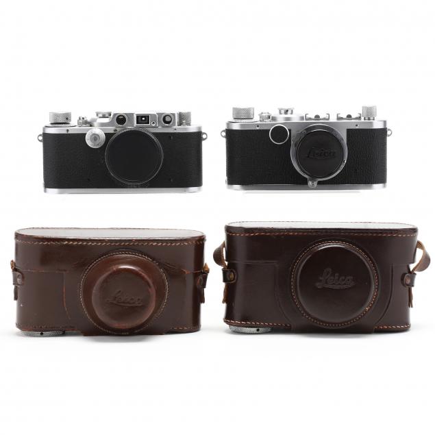 pair-of-vintage-leica-d-r-p-leitz-wetzlar-cameras-one-with-lens