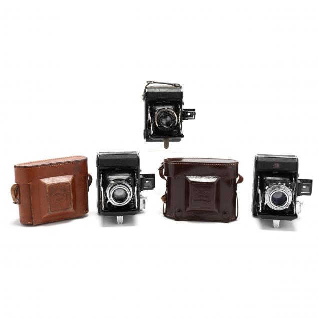 three-vintage-zeiss-ikon-ikonta-521-folding-cameras-two-prewar