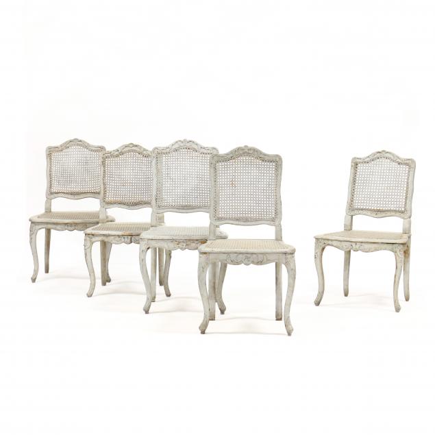 an-assembled-set-of-five-louis-xv-style-painted-cane-seat-chairs