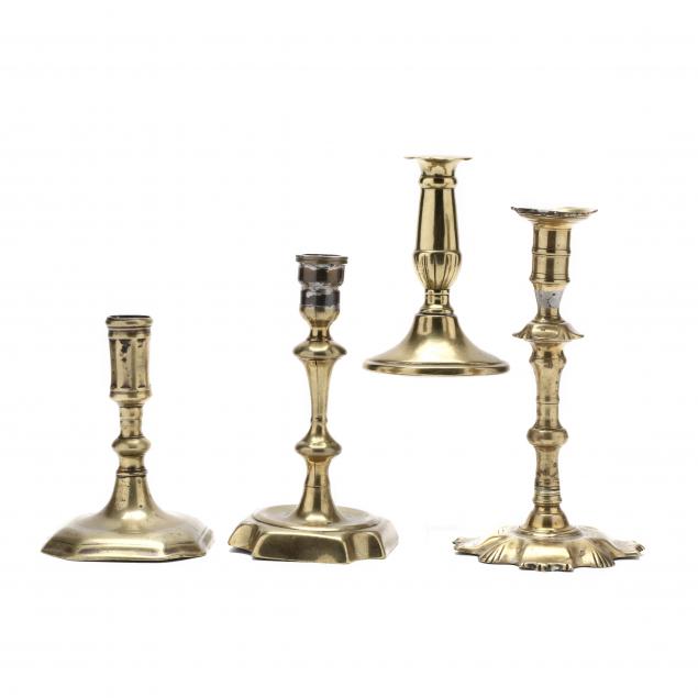 four-antique-brass-candlesticks