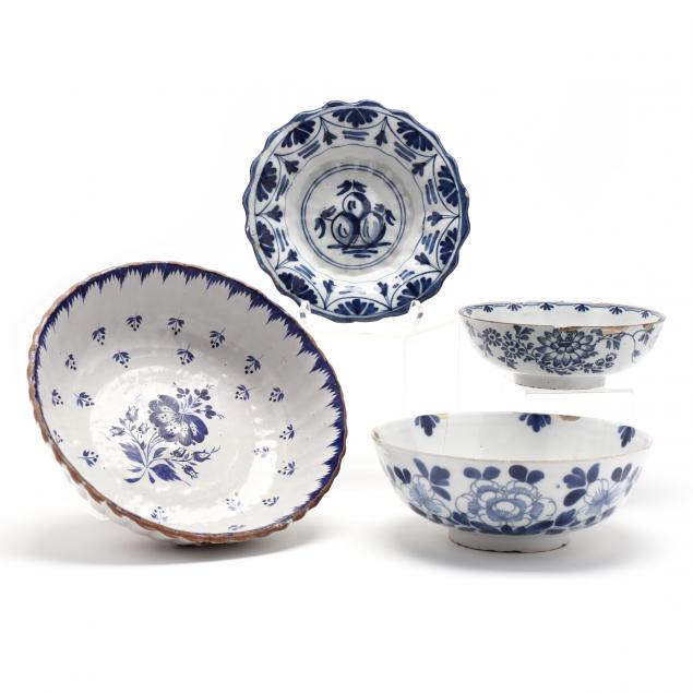 a-group-of-four-blue-and-white-painted-delft-bowls