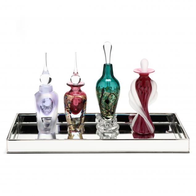 four-art-glass-perfume-bottles-and-mirrored-tray