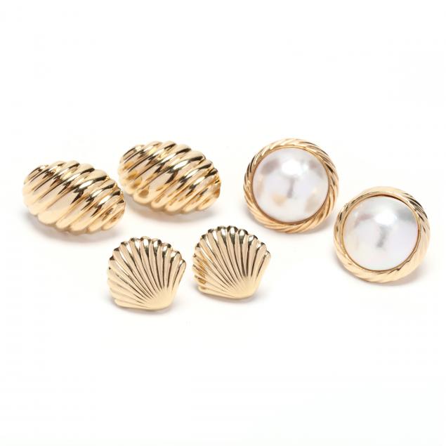 three-pairs-of-gold-earrings