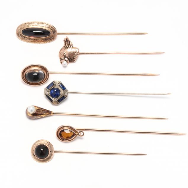 group-of-seven-gold-and-gem-set-stick-pins