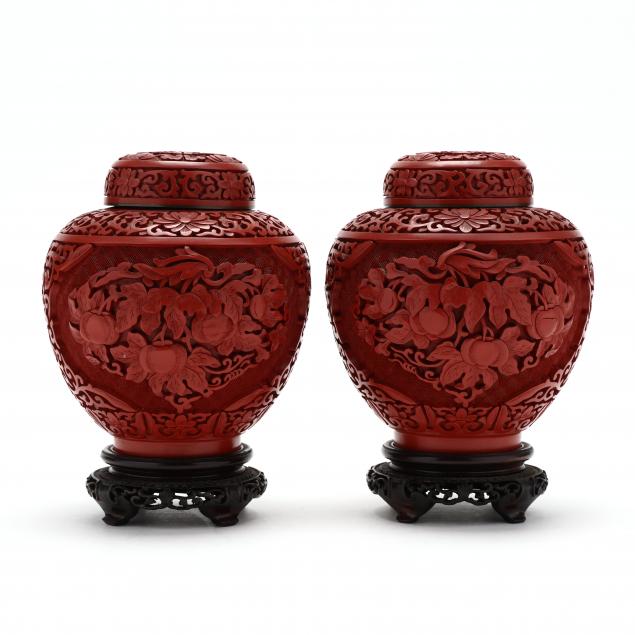 a-pair-of-chinese-carved-cinnabar-lacquer-jars-with-covers