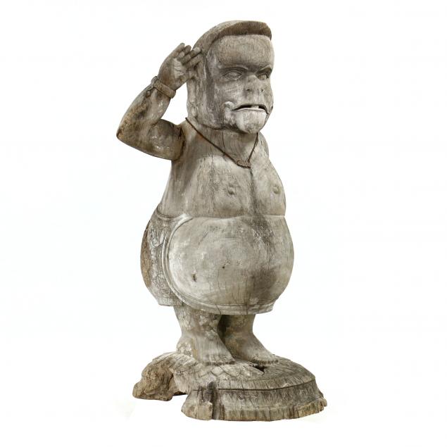 a-monumental-southeast-asian-carved-teak-saluting-figure