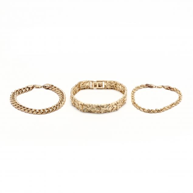 three-gold-bracelets