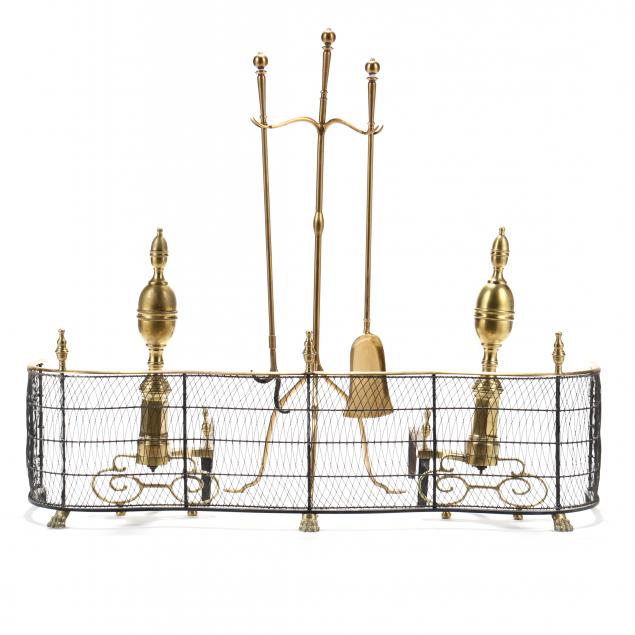 a-grouping-of-brass-fireplace-accesories