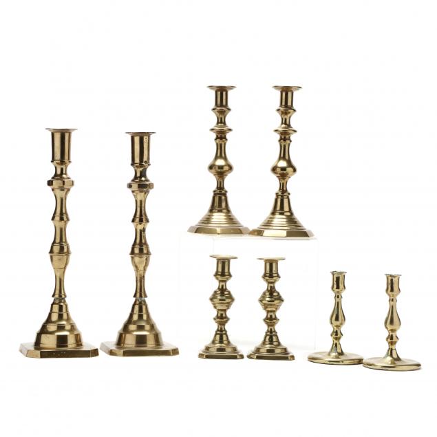 four-pairs-of-antique-brass-candlesticks