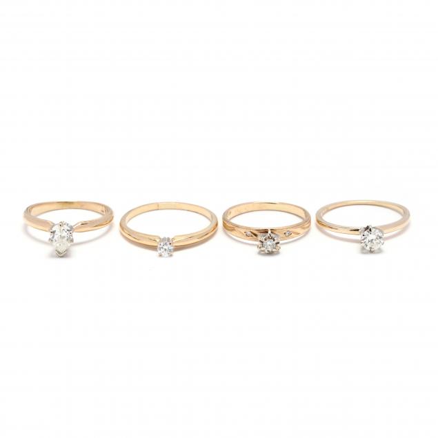 four-gold-and-diamond-solitaire-rings