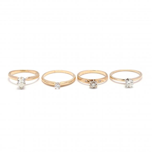 four-gold-and-diamond-solitaire-rings