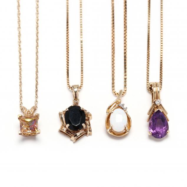 four-gold-and-gem-set-pendant-necklaces