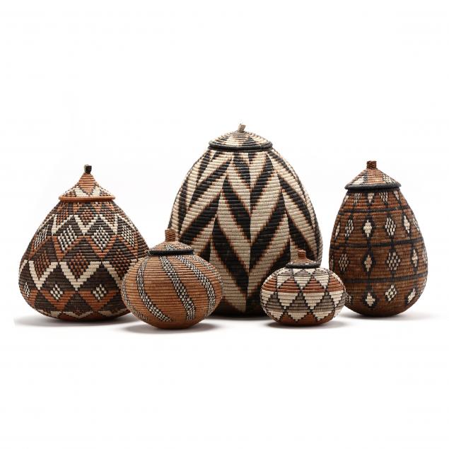 a-group-of-five-zulu-i-ukhamba-i-baskets