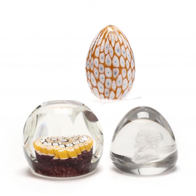 a-grouping-of-three-glass-paperweights