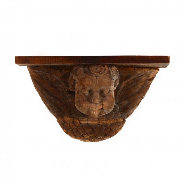 large-folky-carved-putto-wall-bracket