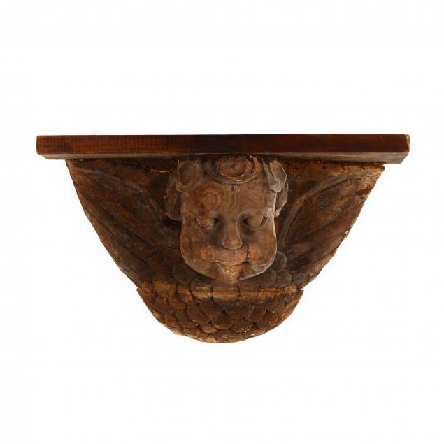 large-folky-carved-putto-wall-bracket
